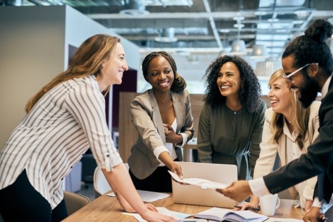 Diverse group of professionals collaborating around a table